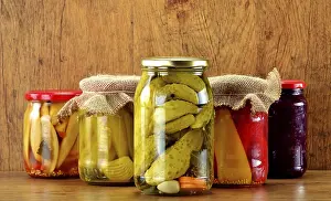 Deserted Table Setting Food Impressions: Composition with jars of pickled vegetables