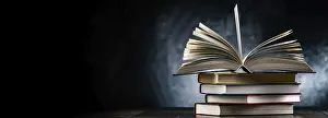 Empty Library Scene Impressions: A composition with an open book lying on a stack of other books
