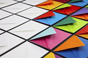 White Envelopes On Table Impressions: Composition with white and colored envelopes on the table