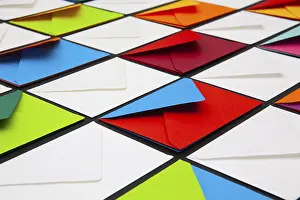 White Envelopes Impressions: Composition with white and colored envelopes on the table