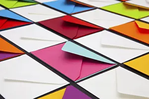 White Envelopes Impressions: Composition with white and colored envelopes on the table
