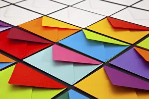 Multicolored Writing Utensils Impressions: Composition with white and colored envelopes on the table