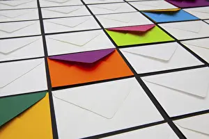 White Envelopes Impressions: Composition with white and colored envelopes on the table