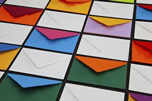 Colorful Envelopes Impressions: Composition with white and colored envelopes on the table