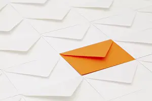 Empty Office Desk Setup Impressions: Composition with white envelopes and one orange envelope on the table