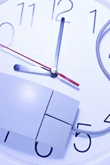 Studio Shot Symbolic Picture Impressions: Computer mouse on clock