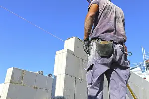 Close Up Construction Impressions: Construction worker (bricklayer) on the building site