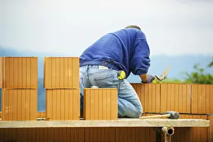 House Building Process Impressions: Construction workers erecting a brick shell