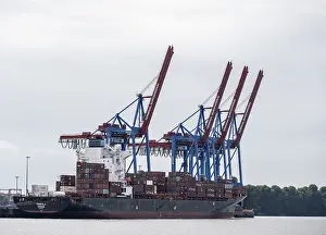Container Ship Hamburg Impressions: Container ship, loading cranes and stacks of containers