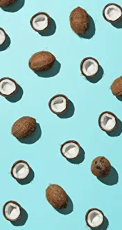 Urban Environment Image Impressions: Creative layout of coconuts half on blue background