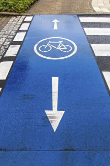 Asphalt Road Markings Impressions: Cycle path marking on a pavement