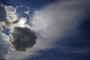 Backlit Cloud Formations Impressions: Different cloud formations with sun emerging