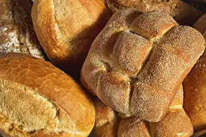 Diverse Breakfast Options Impressions: Different types of bread in one basket