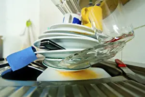 Kitchen Cleanliness Impressions: Dirty tableware in a kitchen