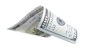 One Hundred Dollar Bill Impressions: One hundred dollar bill falling or floating on empty background