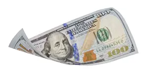 One Hundred Dollar Bill Impressions: One hundred dollar bill falling or floating on empty background