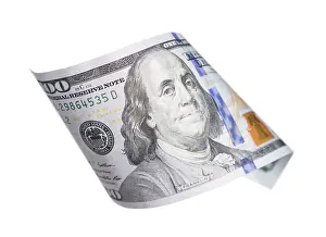 One Hundred Dollar Bill Impressions: One hundred dollar bill falling or floating on empty background