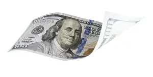 One Hundred Dollar Bill Impressions: One hundred dollar bill falling or floating on empty background