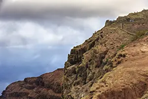 Steep Coastal Region Impressions: Dramatic cliffs above the sea under a cloudy sky