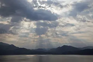 Dramatic Cloud Formation Impressions: Dramatic cloud formation, sunbeams behind dark clouds