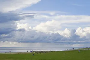 Lower Saxony Waterfront Impressions: Dramatic clouds over the North Sea