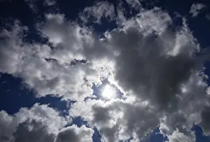 Cloudy Atmosphere Impressions: Dramatic cloudscape with (cumulus) clouds and sunrays