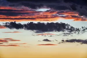 Cloudy Atmospheric Light Impressions: Dramatic cloudy sky, dark storm clouds at sunset
