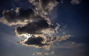 Cloudy Sky With Sun Impressions: Dramatic cloudy sky with sun behind it