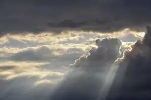 Cloud Formation Photography Impressions: Dramatic cloudy sky with sun rays