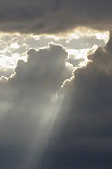 Cloud Formation Photography Impressions: Dramatic cloudy sky with sun rays