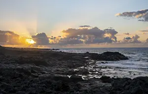 Spanish Coastline Impressions: Dramatic cloudy sky with sunbeams at sunset