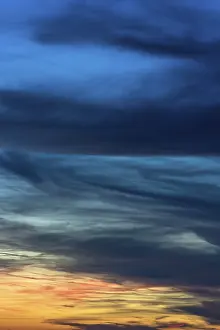 Backlit Cloud Formations Impressions: Dramatic dark clouds in the evening sky