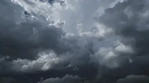 Severe Weather Conditions Impressions: Dramatic dark storm clouds in sky background
