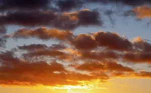 Cloudy Evening Atmosphere Impressions: Dramatic evening sky with clouds at sunset
