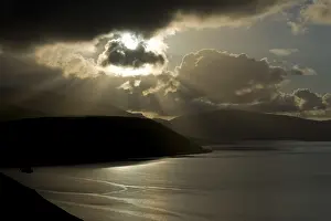 Deserted Coastline View Impressions: Dramatic light mood, cloudy sky