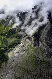 Cloudy Mountain Range Impressions: Dramatic mountain landscape covered in clouds
