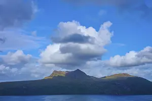 Dramatic Scottish Landscape Impressions: Dramatic sky with big clouds over a shadow-covered mountain
