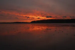 Frozen Lake Landscape Photography Impressions: A dramatic sunset over a still
