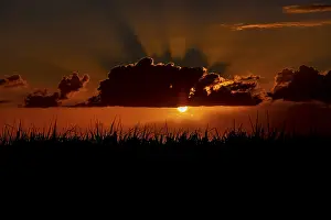 Mauritius Sunset Impressions: Dramatic sunset behind clouds, Chebel