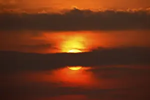 Dramatic European Landscape Impressions: Dramatic sunset behind clouds, Schleswig-Holstein