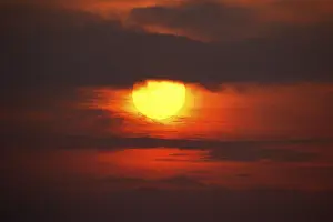 Northern Germany Sunset Impressions: Dramatic sunset behind clouds, Schleswig-Holstein