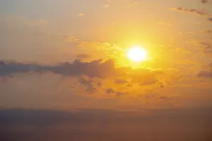 Etosha National Park Namibia Impressions: Dramatic sunset with clouds and sun
