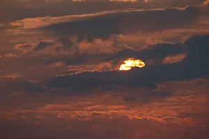 Cloudy Desert Landscape Impressions: Dramatic sunset with clouds and sun