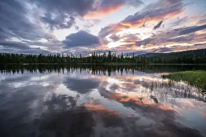 Dramatic Sunset Norway Impressions: Dramatic sunset by the river Namsen with reflection
