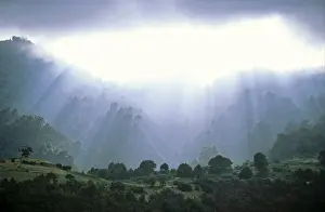 Cloudy Skies Over Mountains Impressions: Dramatically lighted clouds after a thunderstorm