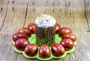 Traditional Easter Table Setting Impressions: Easter cake and painted red Easter eggs