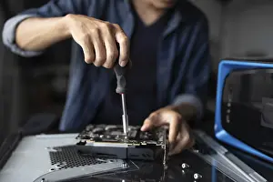 Electronic Repair Shop Impressions: IT Engineer installing Hardware Equipment Development Facility Engineer Maintenance computer Motherboard Electronic