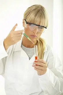 Laboratory Equipment Use Impressions: Female lab worker testing and experimenting