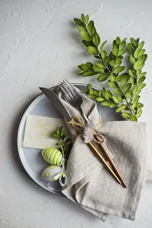 Plain White Background Photo Impressions: Festive table setting for Easter dinner on white background with copy space