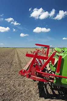 Dutch Windmill Landscape Impressions: Fields with young vegetable fields and detail of planting machine